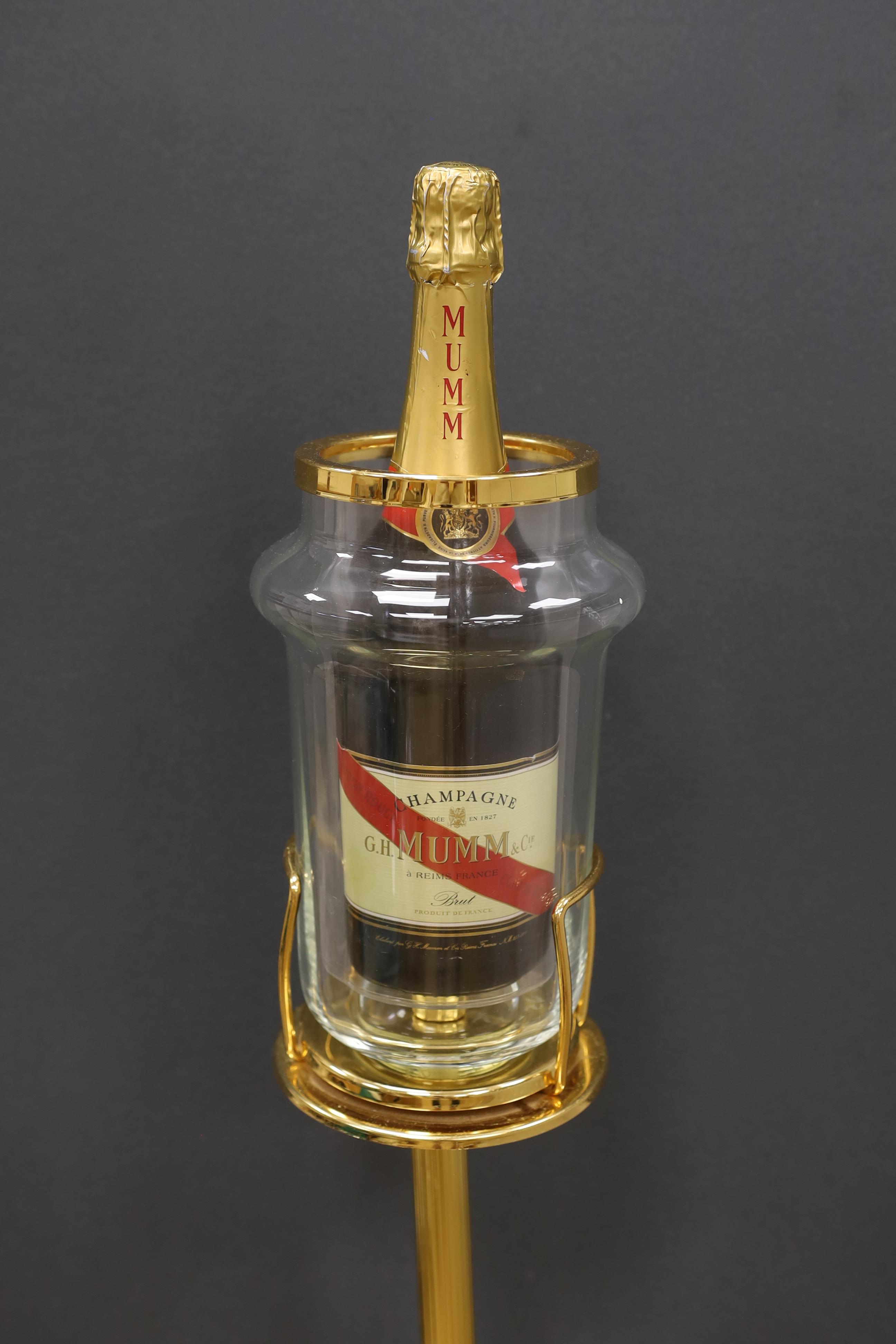A wine cooler on pedestal, marked Faugeron, Paris, with a bottle of Mumm Champagne, 89cm high. Condition- fair, base of bottle holder needs straightening.
